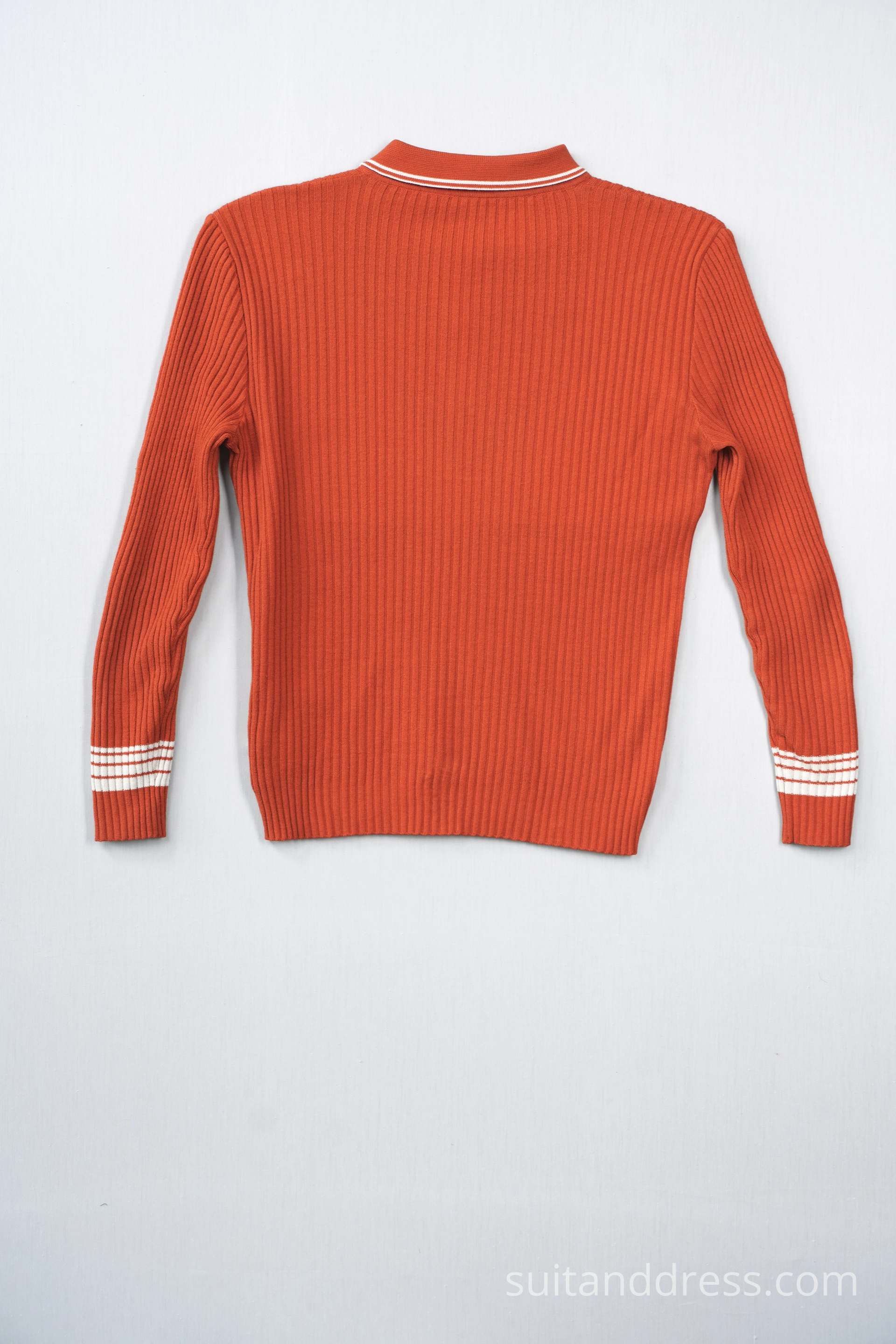 1970s sweater in bright orange vintage costumes warderobe rental for films in Riga Latvia