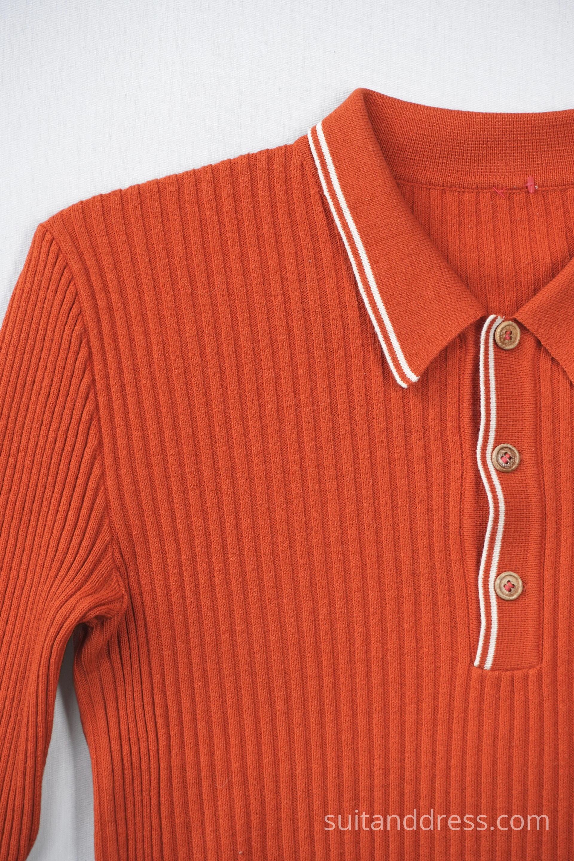 1970s sweater in bright orange vintage costumes warderobe rental for films in Riga Latvia